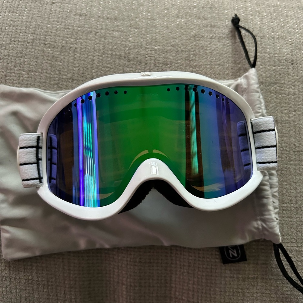 White VR Headset with Reflective Green Lens
